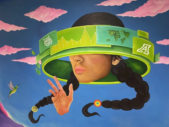 A painting depicts a woman with virtual headset on in front of a desert landscape