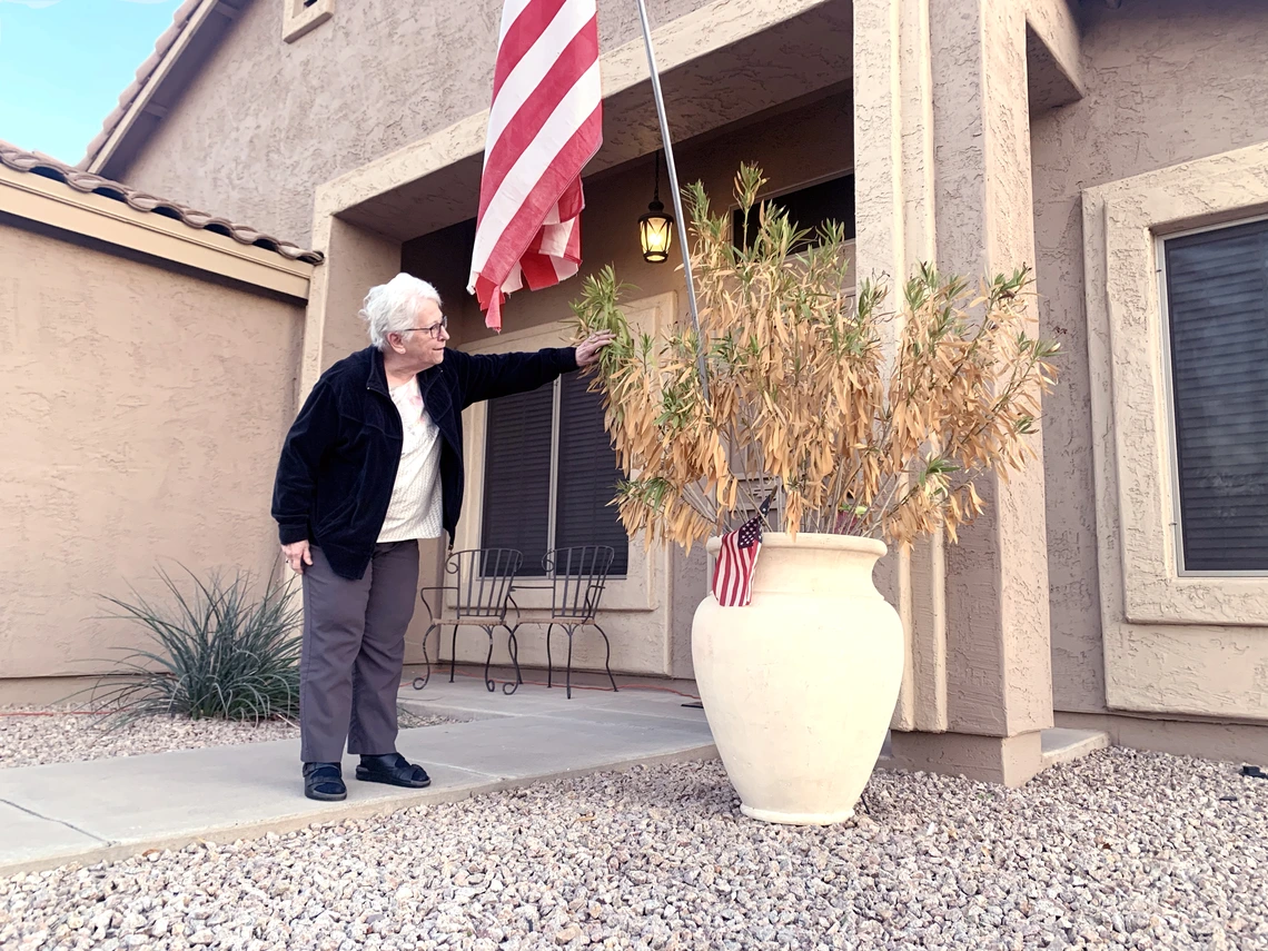 Woman in front of flag 