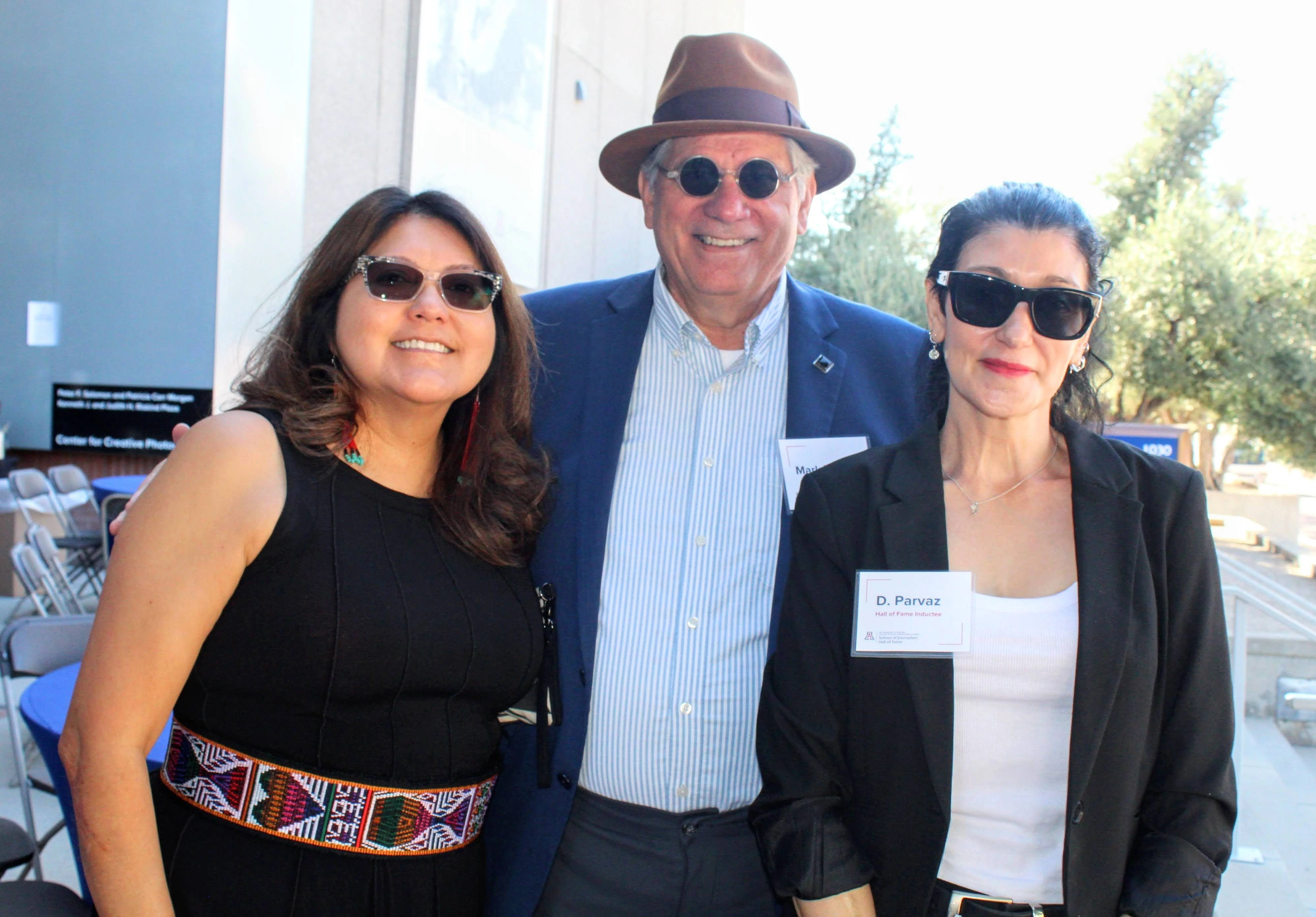 Attendees pose for photo at event