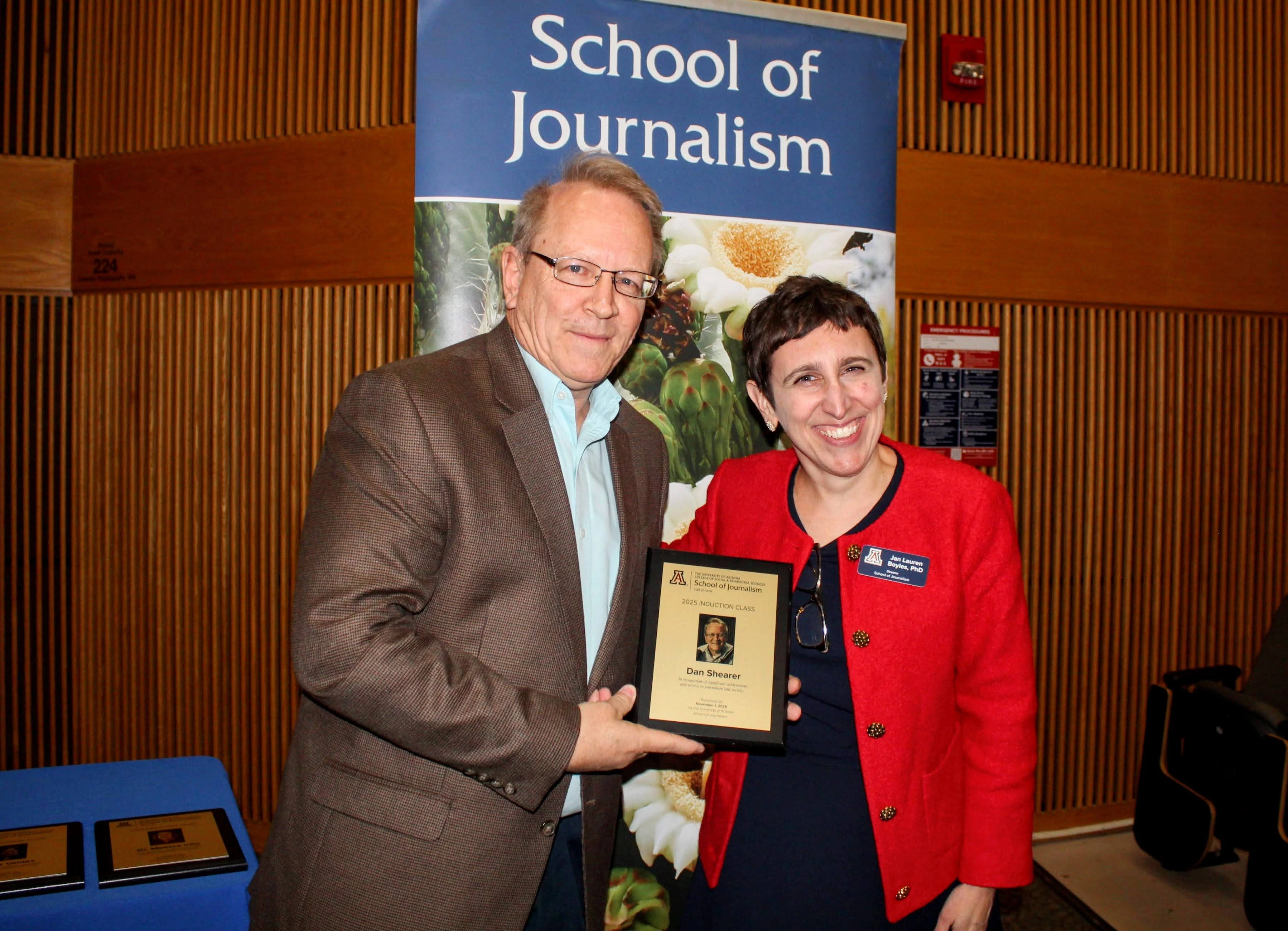 Inductee holds Hall of Fame plaque
