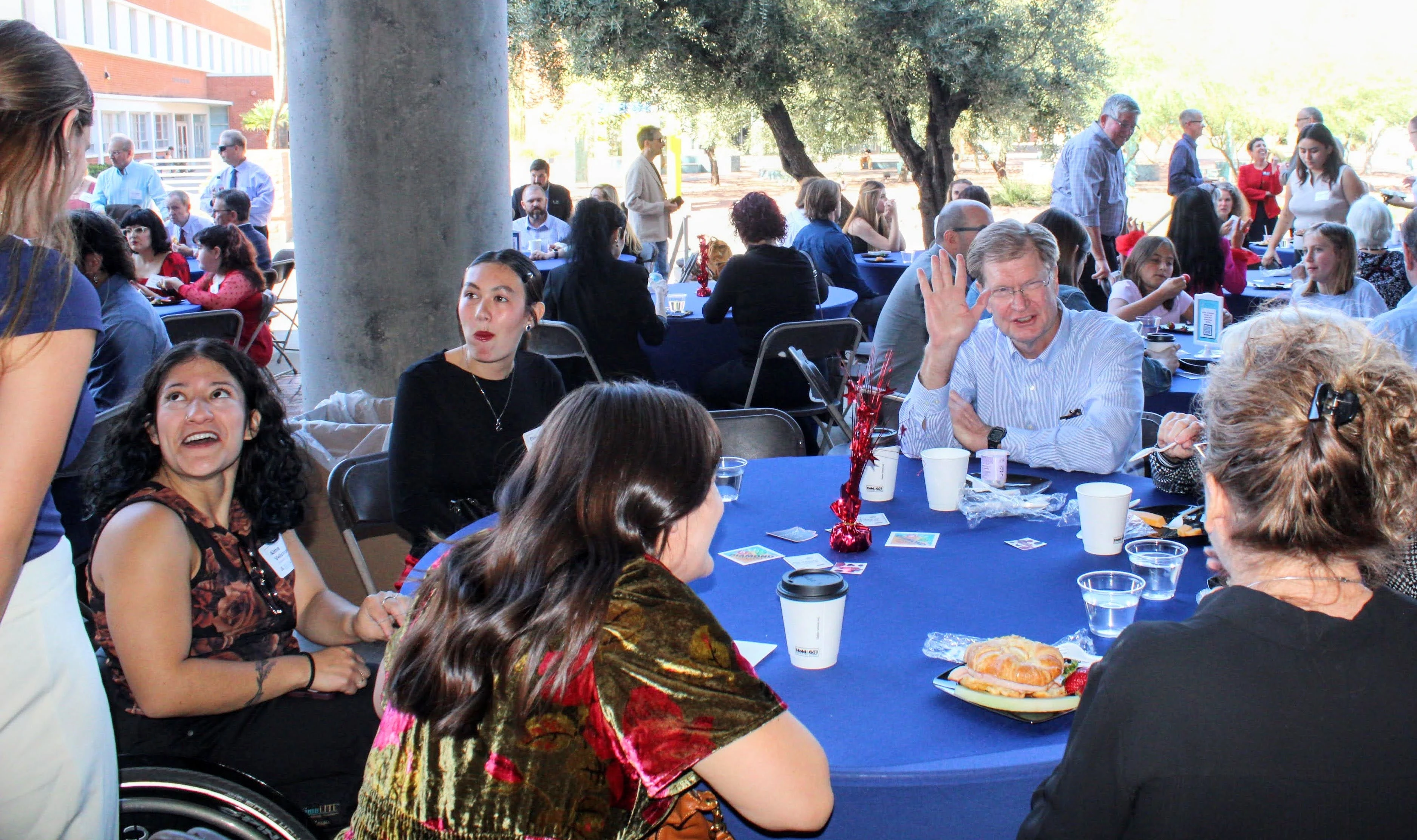 Guests sit at table at event