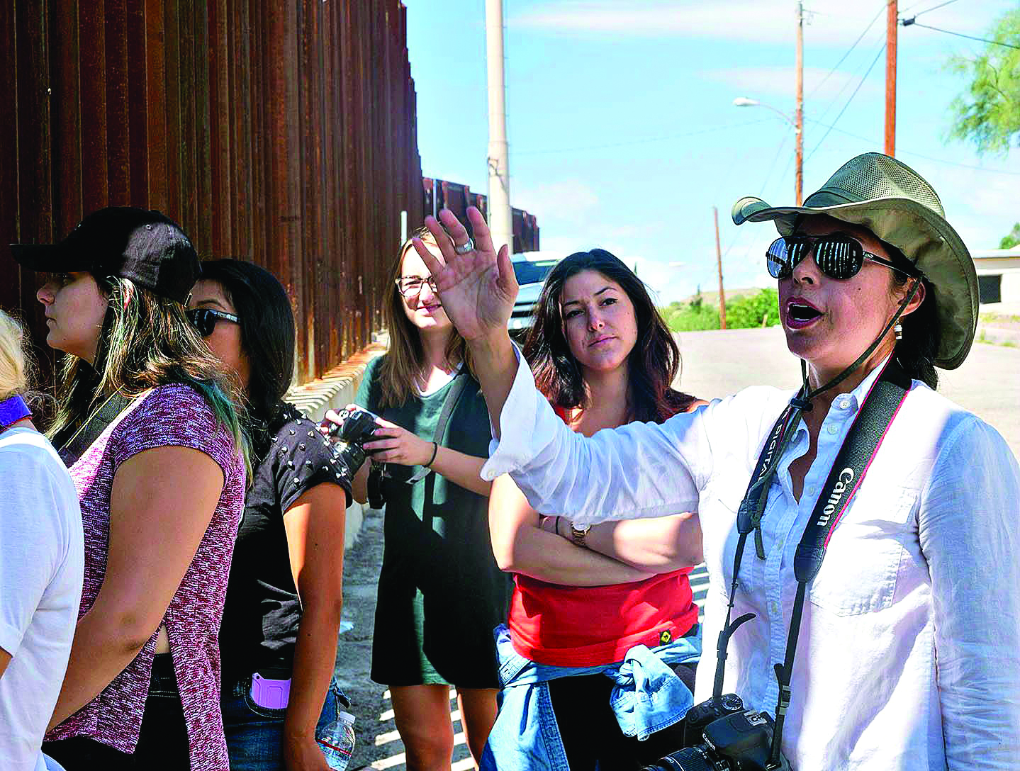 Prof. Celeste González de Bustamante speaks to students at the Mexican border.