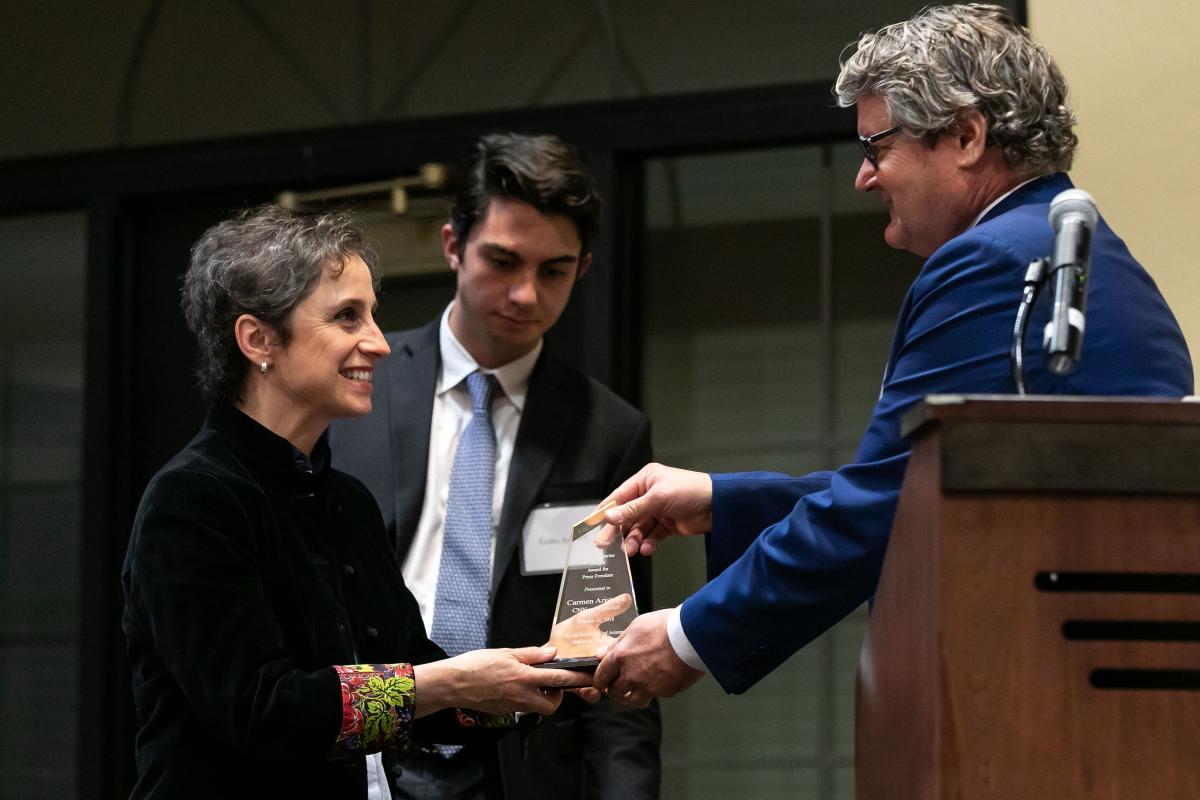 JP Jones, dean of the College of Social & Behavioral Sciences, gives Aristegui the Zenger Award for Press Freedom.