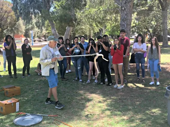 Cecil Schwalbe handles a rattlesnake