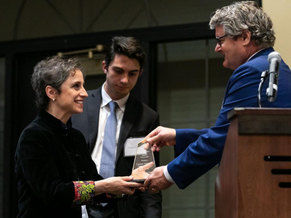 JP Jones, dean of the College of Social & Behavioral Sciences, gives Aristegui the Zenger Award for Press Freedom.