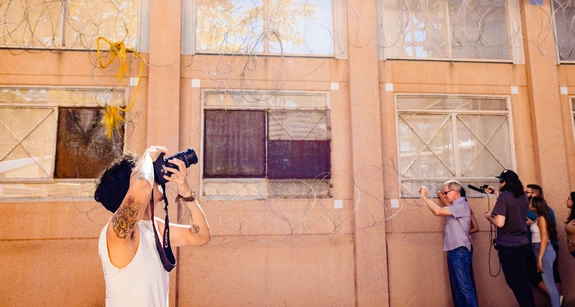 Student photographs a building in Nogales, Arizona