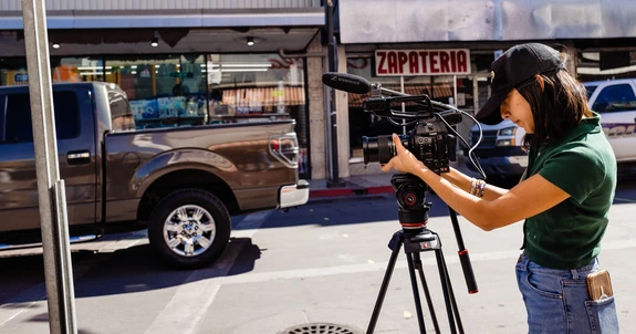 A student records on the streets of Nogales