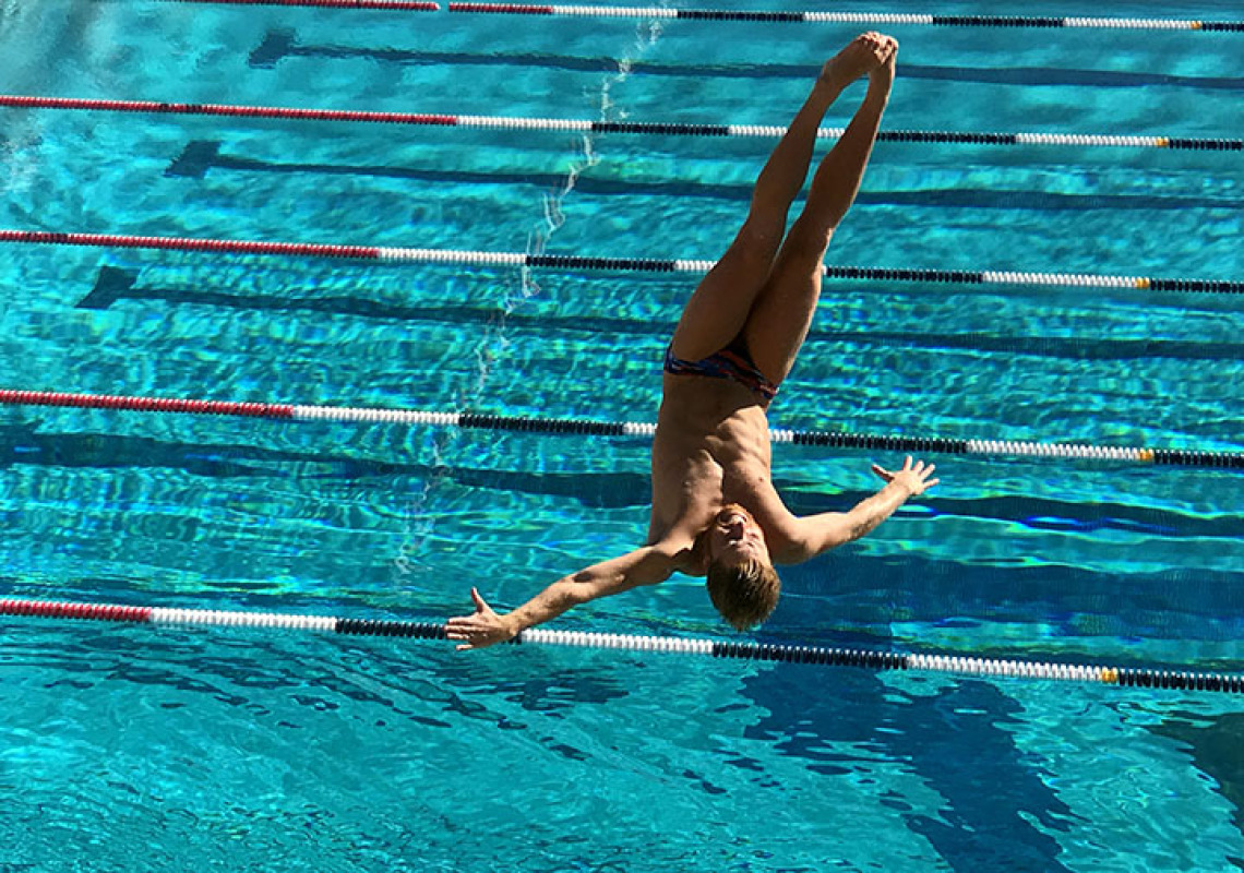 UA diver entering pool