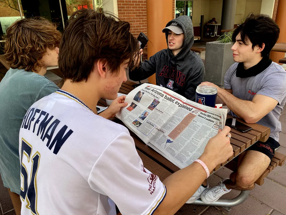 Student reading newspaper