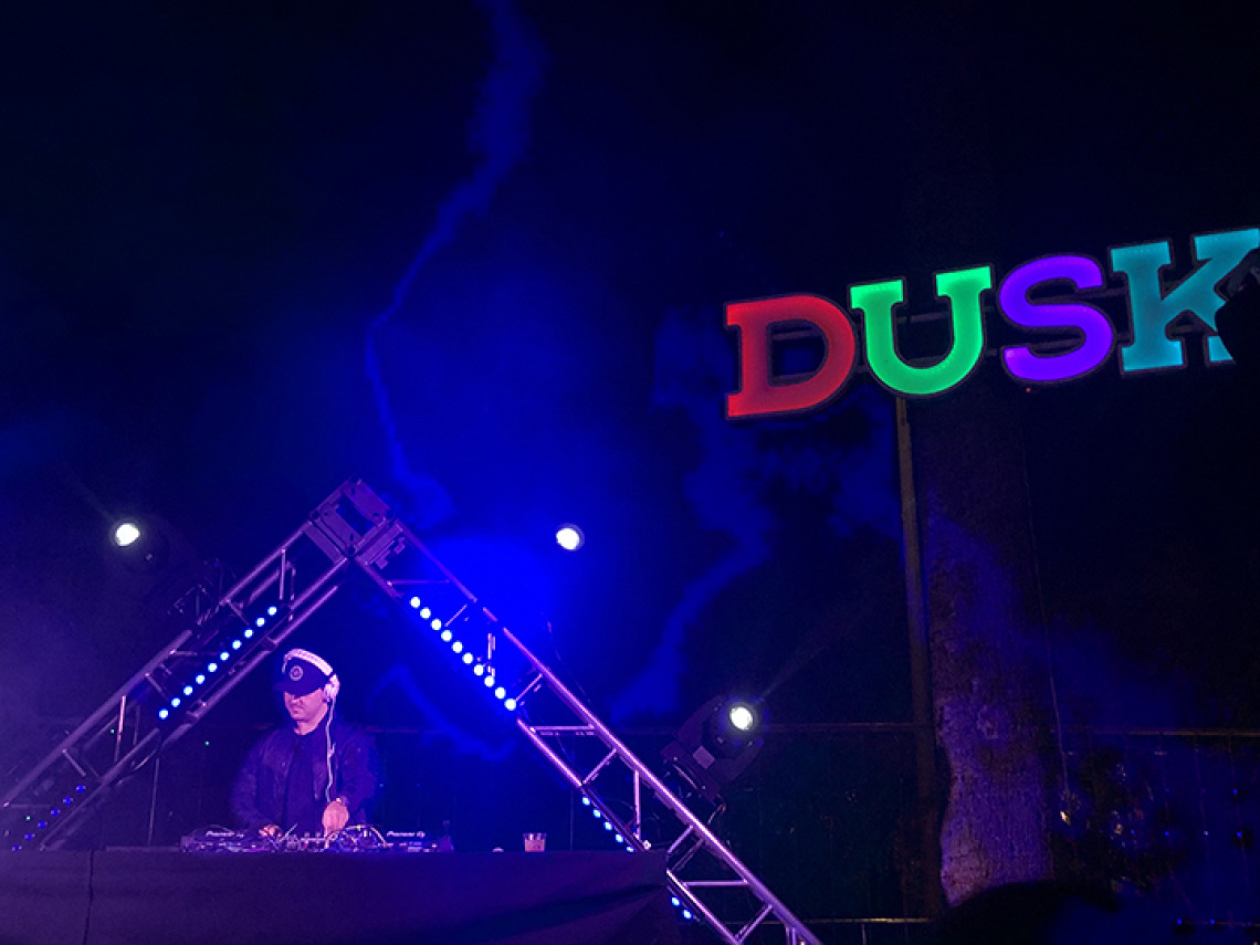 DJ working in dark venue