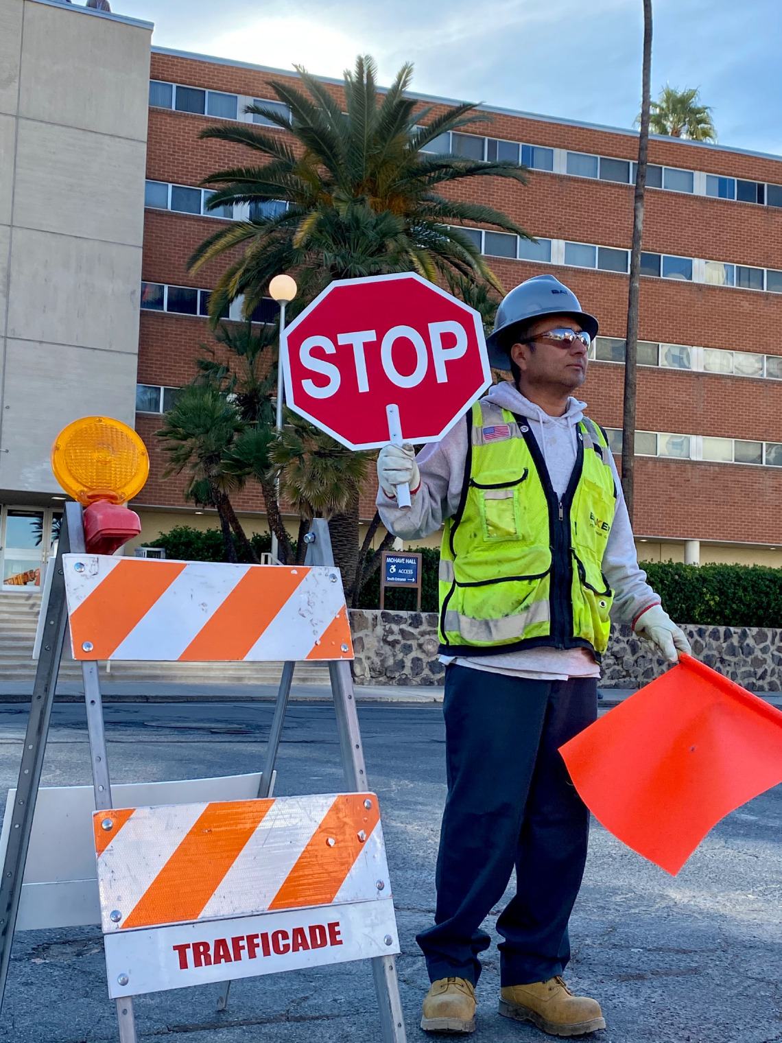 Construction worker directs traffic.