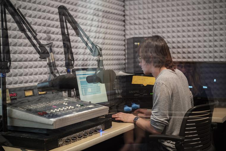 Student in radio recording booth