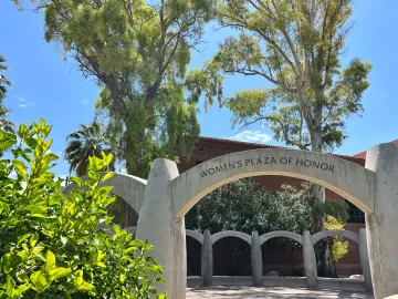 Image displays the Women's Plaza of Honor archway on University of Arizona campus.