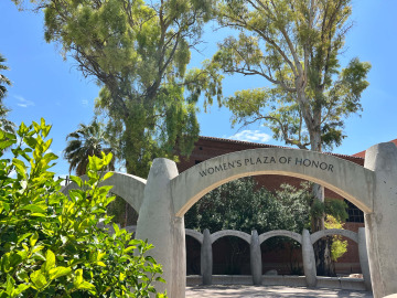 Image displays the Women's Plaza of Honor archway on University of Arizona campus.