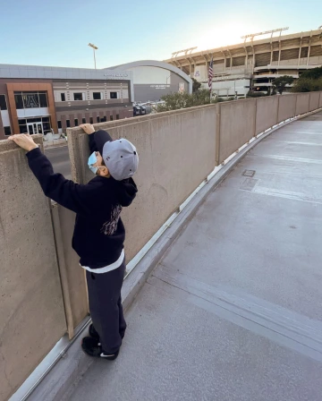 A child stands outside McKale Center