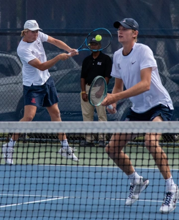 Tennis players play a match