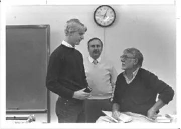 Former journalism student Steve Elliott (left) receives his pen in the Mark Finley Newswriting Competition from Professors Bick Lewis (center) and Phil Mangelsdorf.